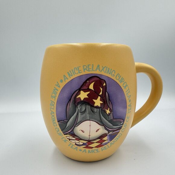 Eeyore Sleeping A Nice Relaxing Cup of Tea Yellow Round Mug Ceramic Disney EUC - Picture 1 of 5